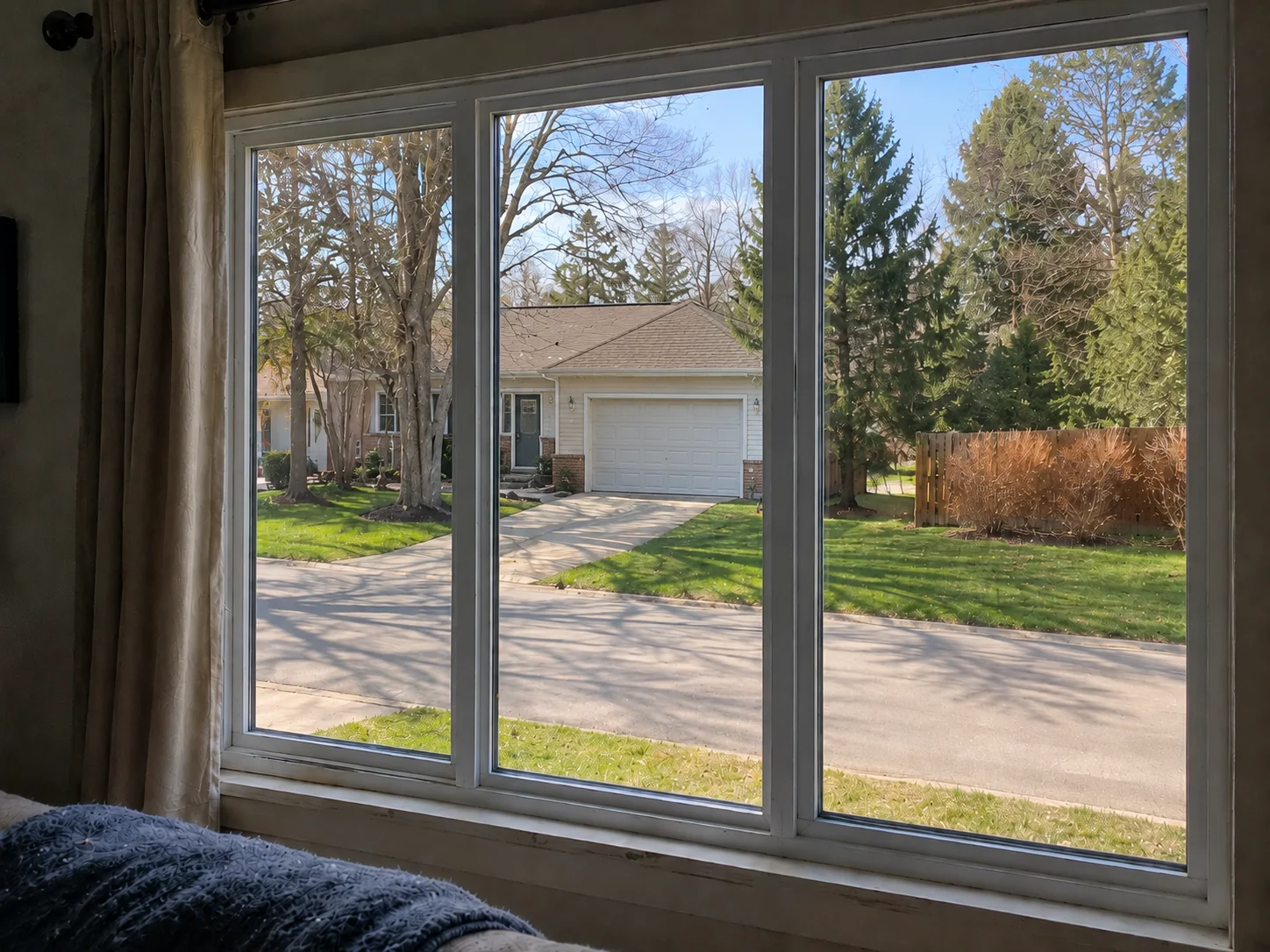 New white vinyl energy-efficient replacement windows after installation by Everguard Exteriors