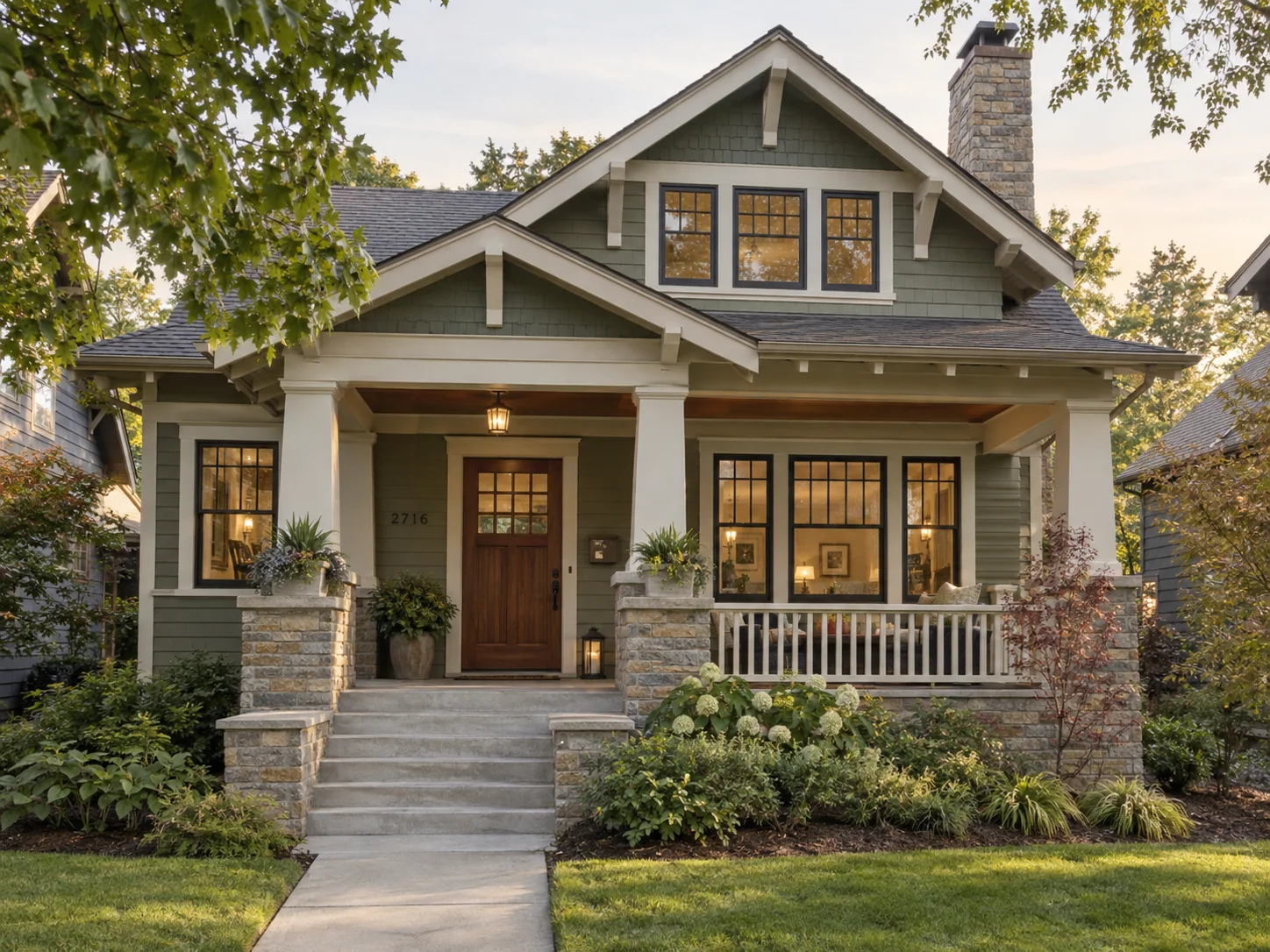 Brown craftsman bungalow with a wood front door and porch